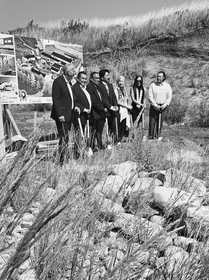 Group of people standing in front of a billboard