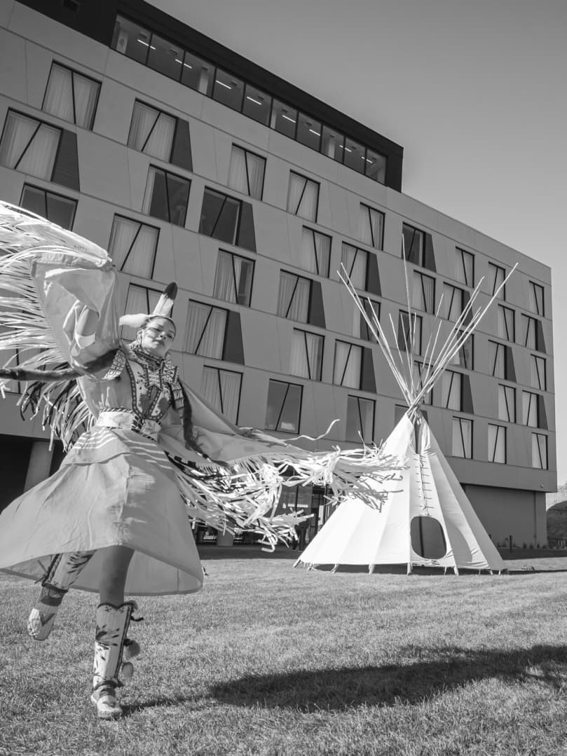 Dancer in front of a building